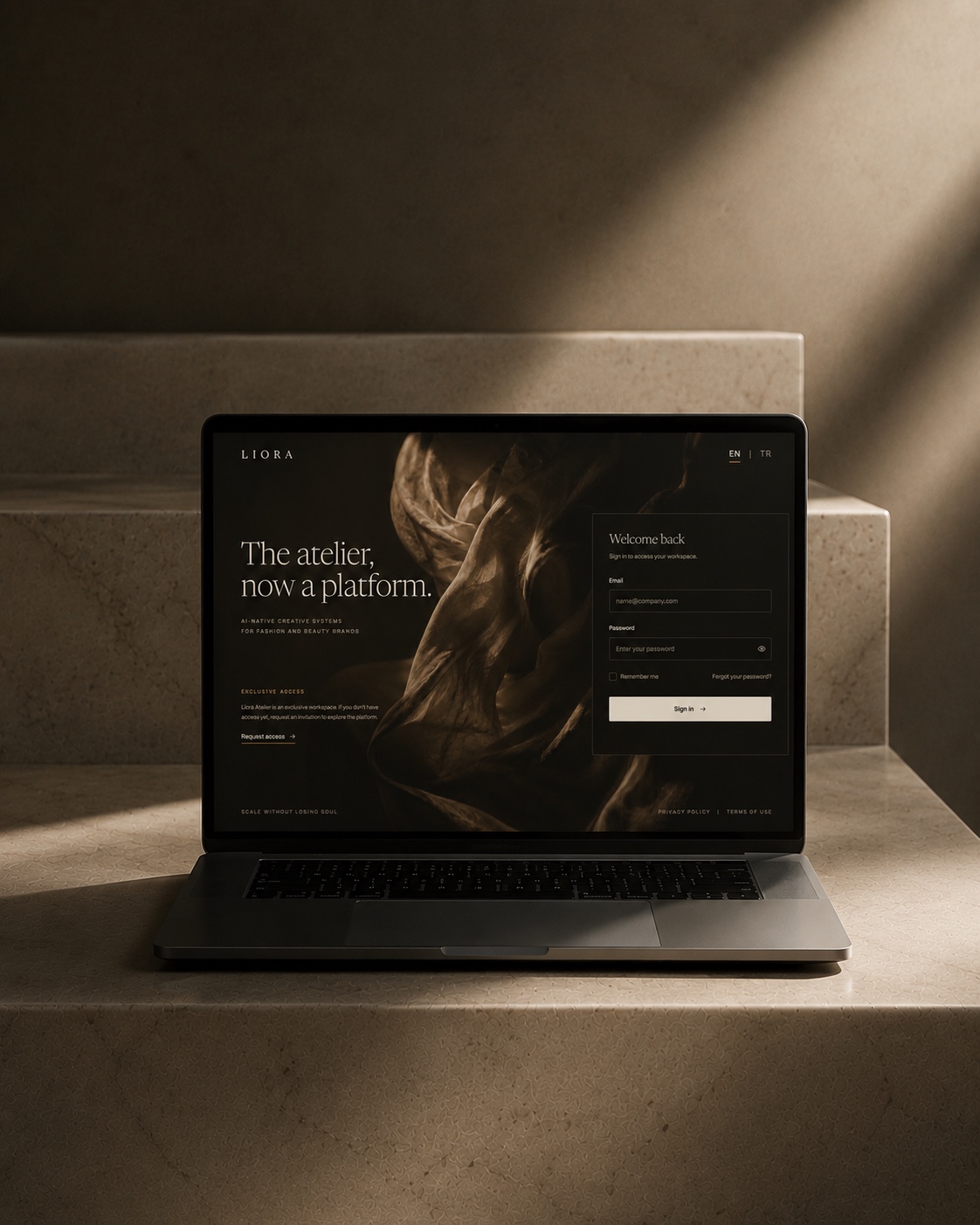 The Liora Atelier platform — a laptop on stone steps showing an editorial brand website
